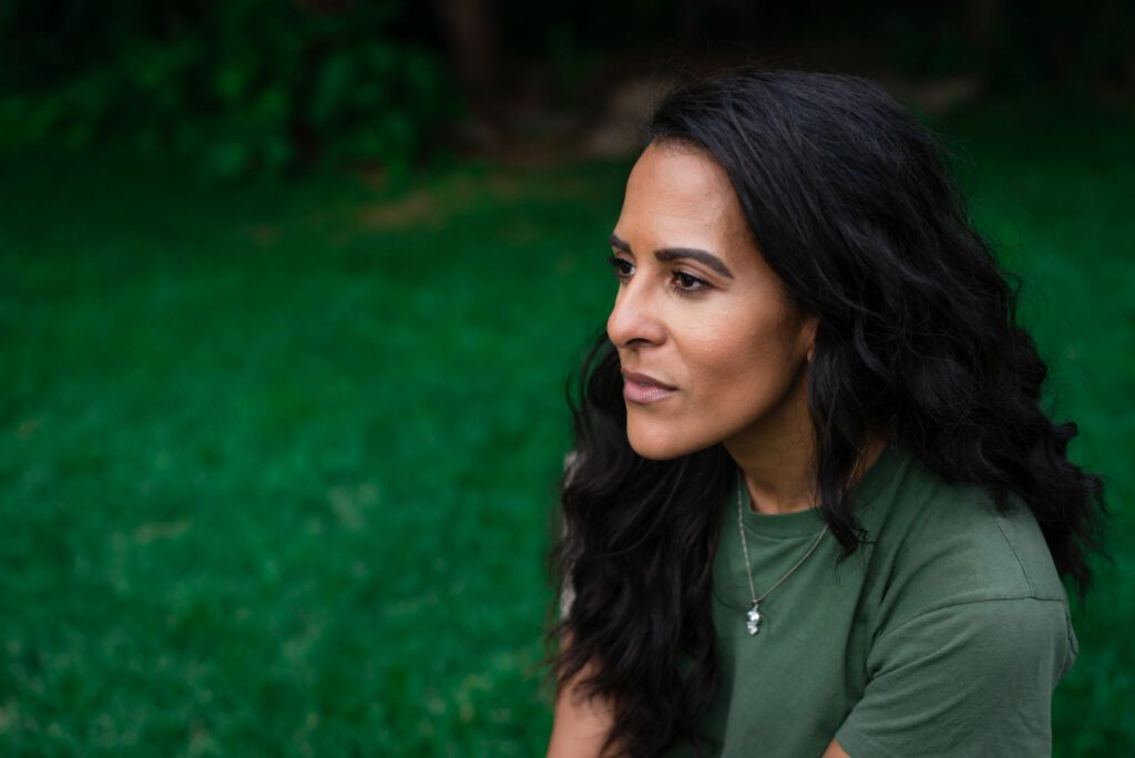 Air Force Veteran Katy Doggett in a contemplative gaze.