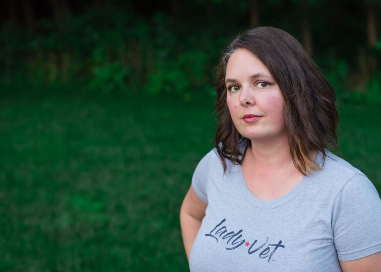 A woman Veteran standing outside
