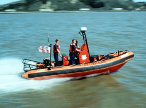 A US Coast Guard Rigid Hull Inflatable Boat in the water, 1999