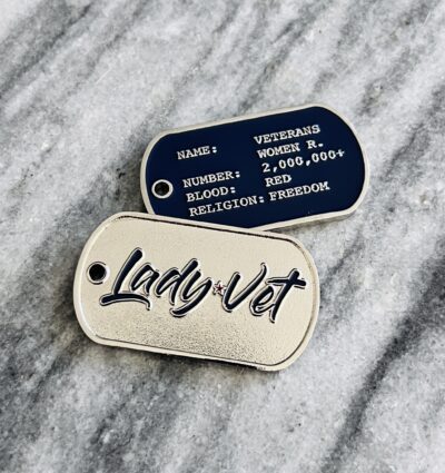 Two Lady Vet Challenge Coins shaped like a dog tag