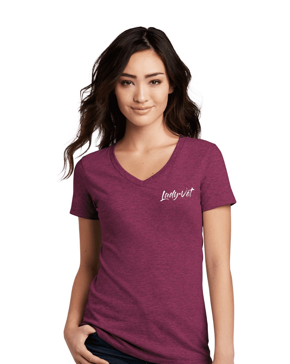A woman in a raspberry color Lady Vet V-neck tee